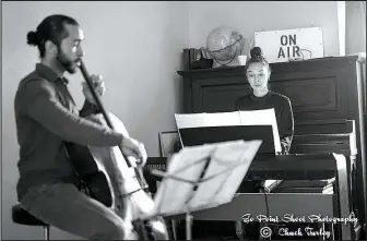  ?? Photo courtesy: Chuck Turley ?? Musicians Christian Davis Serrano-Torres and Sophia-Odelia Bauer perform at last year’s Trillium Salon Series New Year’s Day potluck. Each Trillium concert is free and features different artists and styles of classical music.