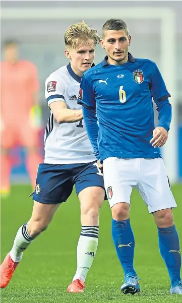  ??  ?? ATTITUDE: Marco Verratti and Ali McCann during the Fifa World Cup Qatar 2022 qualifying match between Italy and Northern Ireland.