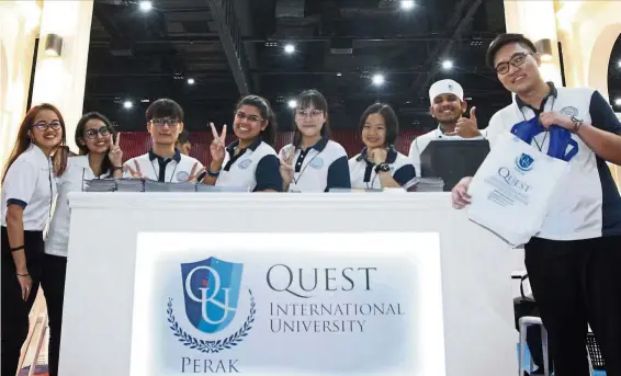  ??  ?? Student ambassador­s from Quest Internatio­nal University Perak taking a group picture at the Star Education Fair last weekend.