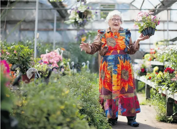  ?? PHOTOS: RYAN JACKSON/EDMONTON JOURNAL ?? Elsie Stocks, 85 — sporting a ruffled, proudly garish floral apron — has spread sunshine at the Old Strathcona Farmers Market since it opened in 1983.