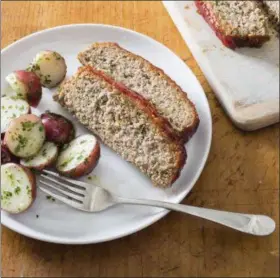  ?? CARL TREMBLAY/AMERICA’S TEST KITCHEN VIA AP ?? This undated photo provided by America’s Test Kitchen in October 2018 shows a turkey meatloaf with a ketchup-brown sugar glaze in Brookline, Mass. This recipe appears in “The New Essentials Cookbook.”