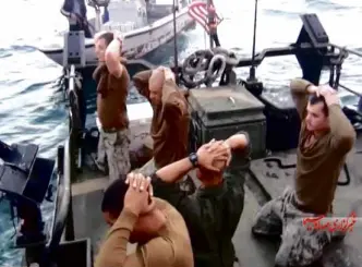  ?? AP ?? AMERICAN Navy personnel with hands on their heads are rounded up by the Iranian Revolution­ary Guards in the Persian Gulf in this frame grab from a video taken by the Iranian state-run Irib news agency.