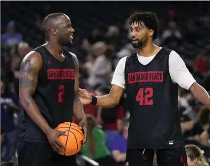  ?? GODOFREDO A. VASQUEZ — THE ASSOCIATED PRESS ?? San Diego State guard Adam Seiko, left, and guard Triston Broughton talk during practice for their Final Four college basketball game in the NCAA Tournament on Friday in Houston. San Diego State and Florida Atlantic play on Saturday.