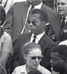  ?? MAGNOLIA PICTURES ?? James Baldwin (center) is shown in a scene from “I Am Not Your Negro,” Raoul Peck’s Oscar-nominated documentar­y.