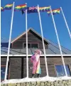  ?? PHOTO: CARDRONA ALPINE RESORT ?? Flying the flag . . . Cardrona staff member Bindy Doust salutes Winter Pride on the mountain yesterday.