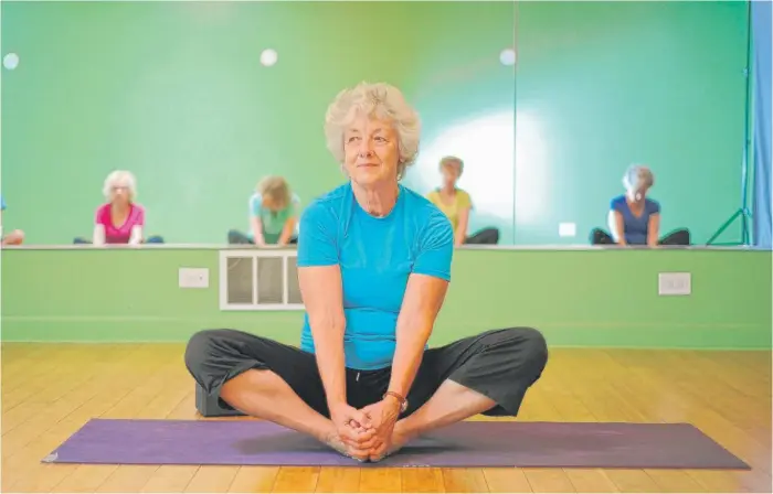  ?? | VICTOR HILITSKI PHOTOS/FOR THE SUN-TIMES PHOTOS ?? Instructor Sharon Steffensen, 70, conducts “Grandma Yoga” classes for seniors at the Chicago School of Yoga, 2442 N. Lincoln. She has taught yoga for 42 years.