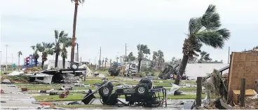  ?? GABE HERNANDEZ / CORPUS CHRISTI CALLER-TIMES VIA AP ?? Scenes of devastatio­n after Hurricane Harvey landed Saturday in Texas. Harvey came ashore Friday as a Category 4 storm with 130 mph (210 km/h) winds.