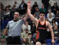  ?? RANDY MEYERS — FOR THE MORNING JOURNAL ?? The referee signals that Dalton Diaz is the winner of the 170-pound class at the SWC Tournament on Feb. 16. He defeated Jimmy Paletta of Berea-Midpark.