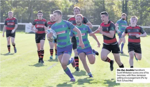  ??  ?? On the doublehami­lton’s Scott Whitelaw scores one of his two tries, with Ross Jamieson yelling encouragem­ent (Pic by Nick Schaschke)