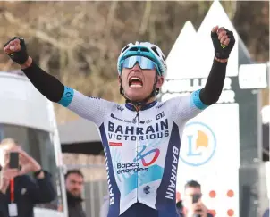  ?? (AFP) ?? Bahrain Victorious’s Colombian cyclist Santiago Buitrago celebrates as he crosses the finish line to win the 4th stage of the Paris-Nice cycling race, covering a distance of 183kms between Chalon-sur-Saone and Mont Brouilly, yesterday.