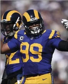  ??  ?? In this Sept. 18, 2016, file photo, Los Angeles Rams defensive tackle Aaron Donald tries to fire up the crowd during the team’s NFL football game against the Seattle Seahawks at Los Angeles Memorial Coliseum in Los Angeles. AP PHOTO/KELVIN KUO