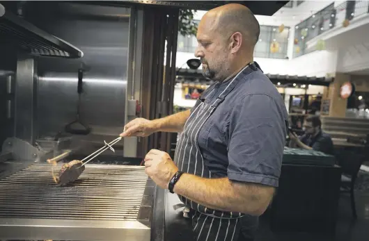  ?? KELLY HODEL/ WAIKATO TIMES ?? Mat McLean cooking his best seller, Greenstone Creek Ribeye on the Asado grill with pohutakawa and manuka.
Palate recently moved to Sky City, Victoria St. McLean said the new location is a lot more fun.