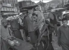  ?? -AP ?? KABUL
Taliban fighters patrol a market in Kabul's Old City, Afghanista­n. A month after the fall of Kabul, the question of how the world will get aid to citizens without enriching Afghanista­n's Taliban rulers is haunting the country.