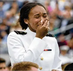  ?? MANUEL BALCE CENETA/AP ?? Midshipman Sarah Skinner, who is a Rhodes Scholar, reacts as President Joe Biden recognizes her during the U.S. Naval Academy’s graduation and commission­ing ceremony Friday.
