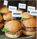  ?? — AFP ?? In this photo taken on Jan 7, 2019 the Impossible Burger 2.0, the new and improved version of the company’s plantbased vegan burger that tastes like real beef, is introduced at a press event during CES 2019 in Las Vegas.