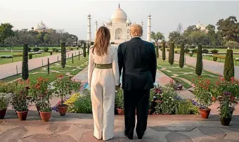  ?? AP ?? President Donald Trump, with first lady Melania Trump, pause as they tour the Taj Mahal in Agra.