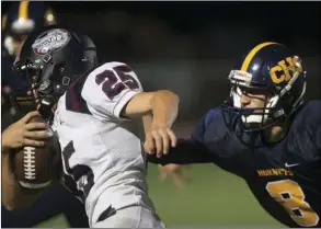  ??  ?? Calipatria High School's Ismael Lopez attempts to tackle an opponent during their home game against Classical Academy High School on Friday night at Veteran's Field in Calipatria. VINCENT OSUNA PHOTO