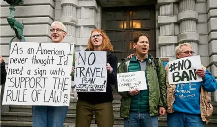  ?? — AP ?? Voices of dissent: Opponents of Trump’s immigratio­n ban converging outside the federal appeals court in San Francisco.