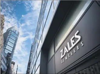  ?? MARK KAUZLARICH — BLOOMBERG ?? Signage for Zales Jewelers, a subsidiary of Signet Jewelers Ltd., is displayed on the exterior of a store in New York in August 2017.