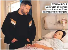  ?? ?? TOUGH ROLE Lucy with on-screen
son Aaron as Chas is prepared for surgery
