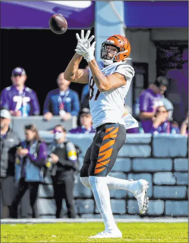  ?? Terrance Williams The Associated Press ?? Cincinnati Bengals tight end C.J. Uzomah hauls in a touchdown pass during Sunday’s win over the Baltimore Ravens at M&T Bank Stadium in Baltimore.