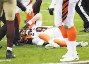  ?? Daniel Kucin Jr. / Associated Press ?? Bengals quarterbac­k Joe Burrow was knocked out of the game after he was hit during a pass attempt.