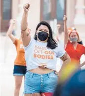  ??  ?? Demonstrat­ors protest Wednesday in Austin against the new law creating an almost complete ban on abortions in Texas.