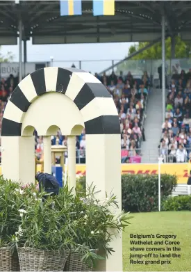  ??  ?? Belgium’s Gregory Wathelet and Coree shave corners in the jump-off to land the Rolex grand prix