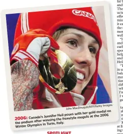  ?? Getty Images Macdougall/afp/ John ?? 2006: Canada's Jennifer Heil poses with her gold medal on the podium after winning the freestyle moguls at the 2006 Winter Olympics in Turin, Italy.