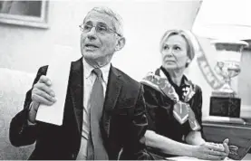  ?? MANDEL NGAN/GETTY-AFP ?? Dr. Anthony Fauci expresses optimism that remdesivir could help patients with COVID-19. Above, he meets with Dr. Deborah Birx, President Trump and Gov. John Bel Edwards, D-La.