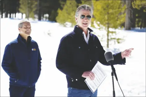  ?? PAUL KITAGAKI JR. AP PHOTO/ ?? Gov. Gavin Newsom announces the new California Water Plan with California Natural Resources Secretary Wade Crowfoot during the April snow survey at Phillips Station in El Dorado County on Tuesday.