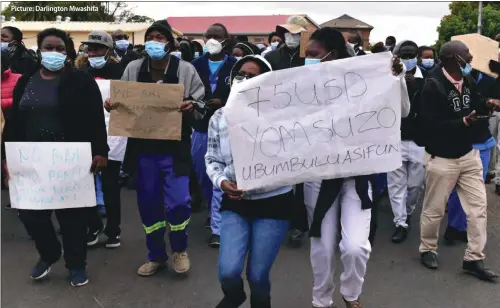  ??  ?? Picture: Darlington Mwashita
Nurses protest at Mpilo Central Hospital in Bulawayo demanding better salaries. This comes after the government increased civil servants' salaries by 50% across the board in addition to an allowance of US$75 per month. The health workers said the money was not enough.