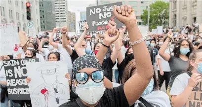  ?? GRAHAM HUGHES THE CANADIAN PRESS ?? Protesters call for justice for the death of George Floyd and all victims of police brutality, in Montreal on June 7.