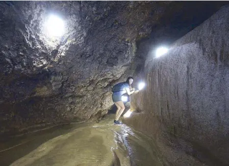  ??  ?? Grant explores Angel Cave, an uncharted cave in Bani, Pangasinan that she helped discover.