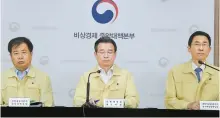  ?? Yonhap ?? First Vice Minister of Economy and Finance Kim Yong-beom, center, presides a briefing following an economic emergency meeting at the Seoul Government Complex, Thursday.
