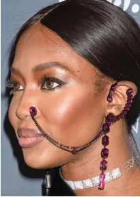  ??  ?? A nose for fashion: Naomi’s face chain