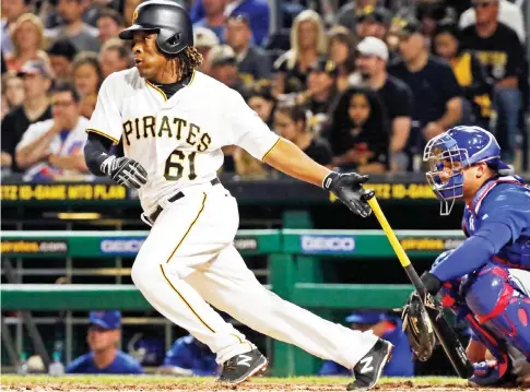  ?? AP ?? MAKING A CONNECTION: Pittsburgh Pirates’ Gift Ngoepe, from Gauteng, the first baseball player from Africa to play in the Major League, hits a single off Chicago Cubs starting pitcher Jon Lester in his first at-bat in the fourth inning of a baseball...