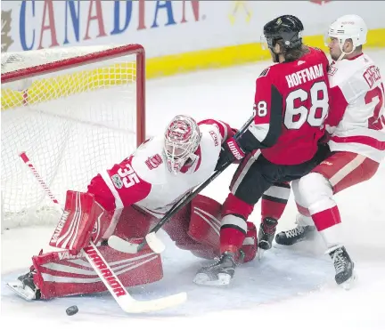  ?? ADRIAN WYLD/ THE CANADIAN PRESS ?? Jimmy Howard was pretty sharp in goal for the Detroit Red Wings but didn’t stop everything, as Mike Hoffman and the Ottawa Senators scraped out a 3-1 victory over the visitors at the Canadian Tire Centre Thursday night.