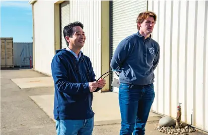  ?? Yuba Water Agency ?? A University of California Berkeley professor with CITRIS, Kenichi Soga, holds fiber optic cables at the beginning of a CITRIS levee site visit on April 19 in Olivehurst. Fiber optic cables could be used to improve levee monitoring.