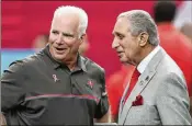  ?? AJC 2016 ?? Falcons owner Arthur Blank (right) notes that past hires such as Mike Smith have had sustained success — but Smith had an establishe­d quarterbac­k.