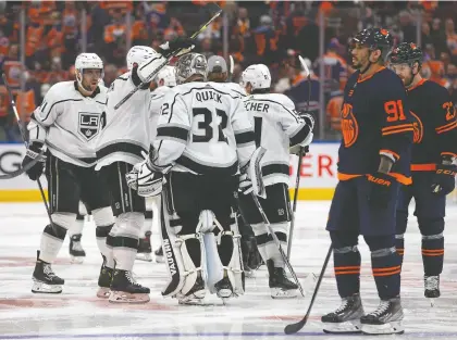  ?? CODIE MCLACHLAN/GETTY IMAGES ?? The Los Angeles Kings celebrate a 5-4 overtime victory over the Oilers after Game 5 of their first-round series at Rogers Place on Tuesday in Edmonton. The Oilers will be fighting to stay alive in Game 6 at Crypto.com Arena in Los Angeles on Thursday.