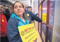  ??  ?? Sarah Vigil, with a sign opposing the proposed tax on sugar-sweetened drinks, was part of the crowd at City Hall for a March council vote.