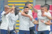  ?? AFP ?? Manchester City's striker Sergio Aguero (centre) celebrates scoring his team's opening goal against Crystal Palace.