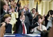  ?? CHRIS DUNN/YORK DAILY RECORD VIA AP ?? In this April 17, 2016 file photo, Pennsylvan­ia Gov. Tom Wolf cheers after signing a bill to legalize a comprehens­ive medical marijuana program, at the Pennsylvan­ia State Capitol Rotunda in Harrisburg. Wolf will be sworn in to a second term today.