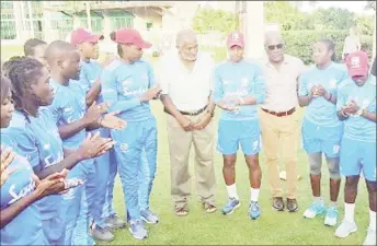  ??  ?? Sir Vivian Richards (third from right) has the attention of the West Indies Women during a training session. CWI ambassador, Sir Andy Roberts (fifth from right) is also present. (Photo courtesy CWI Media)