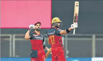  ?? BCCI ?? While RCB skipper Virat Kohli (L) became the first player to score 6,000 runs in IPL, left-hander Devdutt Padikkal hit his maiden league ton against RR on Thursday.