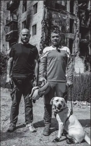  ?? ?? Padraig O’Keeffe with Cooper the dog and local Ukrainian assistant, Viktor