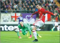  ?? ANDREW COULDRIDGE / REUTERS ?? Manchester United’s Henrikh Mkhitaryan scores against Anderlecht during Thursday’s UEFA Europa League quarterfin­al, first-leg match at Constant Vanden Stock Stadium in Brussels, Belgium.