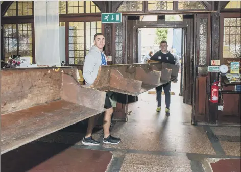  ?? Pictures: Habibur Rahman ?? OUT WITH THE OLD... Sailors removing pews at St Luke’s Church, Southsea