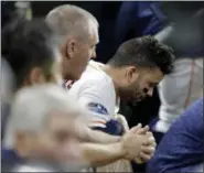  ?? DAVID J. PHILLIP — THE ASSOCIATED PRESS ?? Astros’ Jose Altuve sits in the dugout during the eighth inning of Thursday night’s game in Houston.